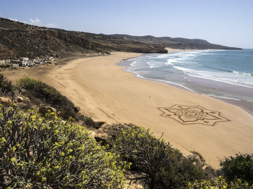 Iftane, beach art, sand drawing, dougados, morocco, essaouira