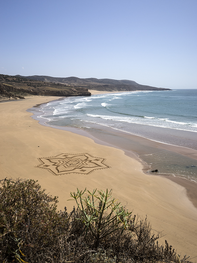 Iftane, beach art, sand drawing, dougados, morocco, essaouira